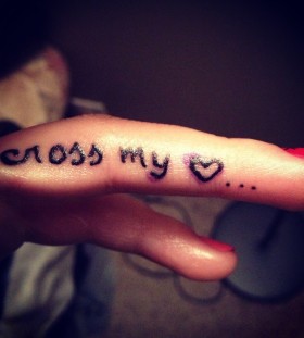 Cross my love quote tattoo on finger