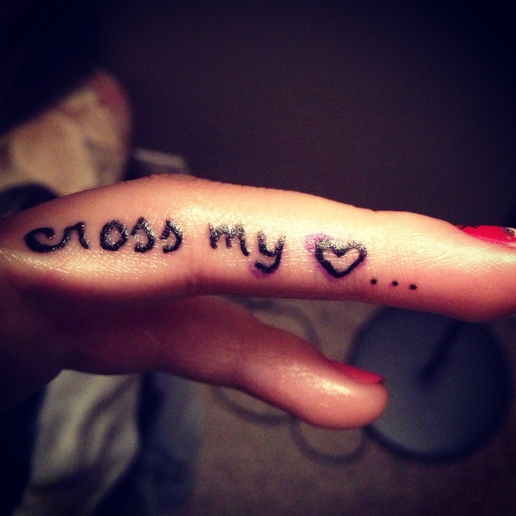 Cross my love quote tattoo on finger