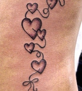 Cute black heart tattoo