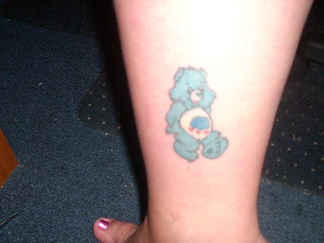 Cute blue bear tattoo on leg
