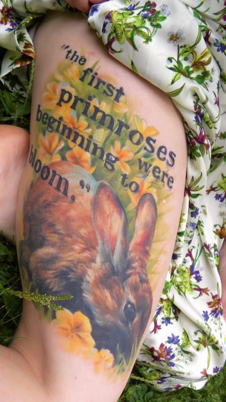 Cute flowers rabbit tattoo on body