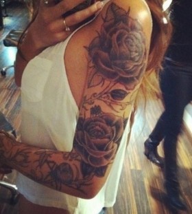 Cute girl rose tattoo on arm
