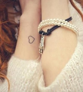 Cute girl's heart tattoo