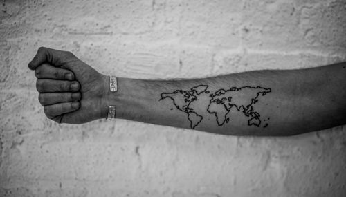 Cute lovely black map tattoo on arm