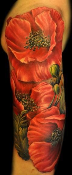 Cute red poppy tattoo on arm