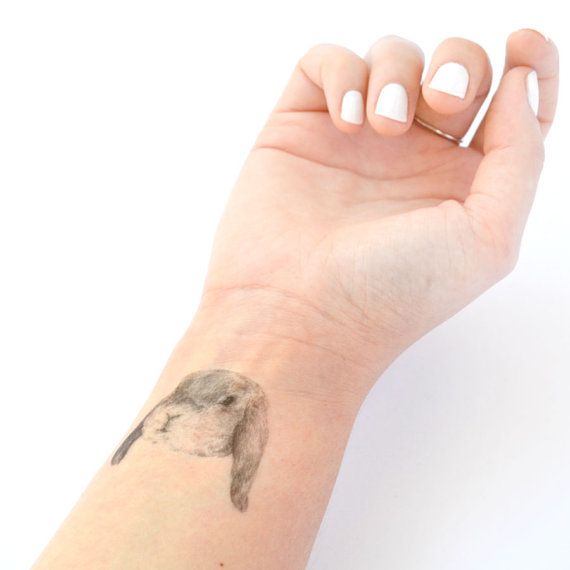 Cute temporary rabbit tattoo on arm