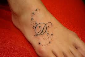 D letter tattoo on foot