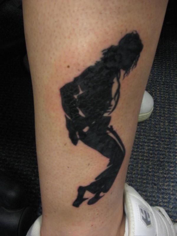 Dancing Michael Jackson on arm tattoo