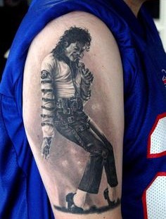 Dancing Michael Jackson tattoo on arm