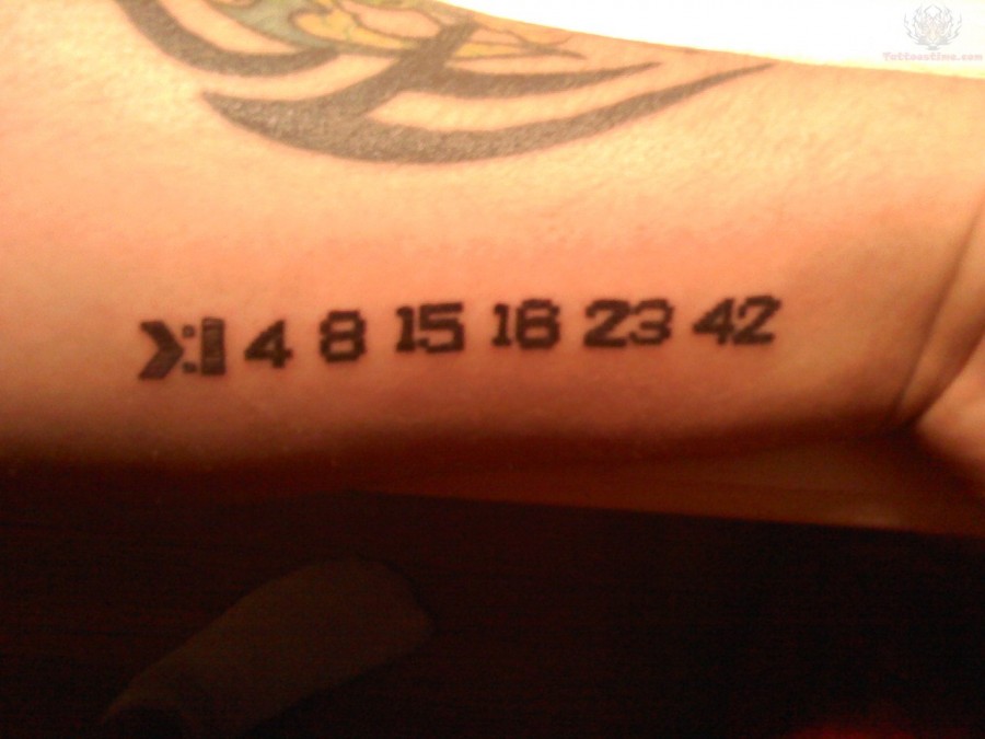Digital black number tattoo on arm