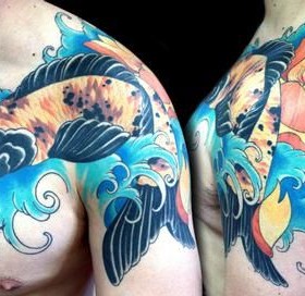 Dragon blue fish tattoo on arm
