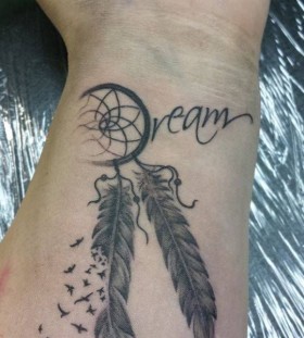 Dream catcher tattoo on wrist
