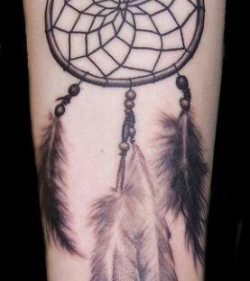 Dream catcher tattoo with awesome feathers