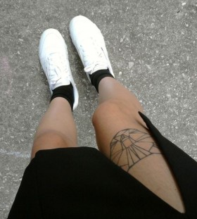 Egypt style girl's origami tattoo on leg