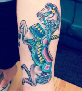 Elegant and colorful horse tattoo on arm
