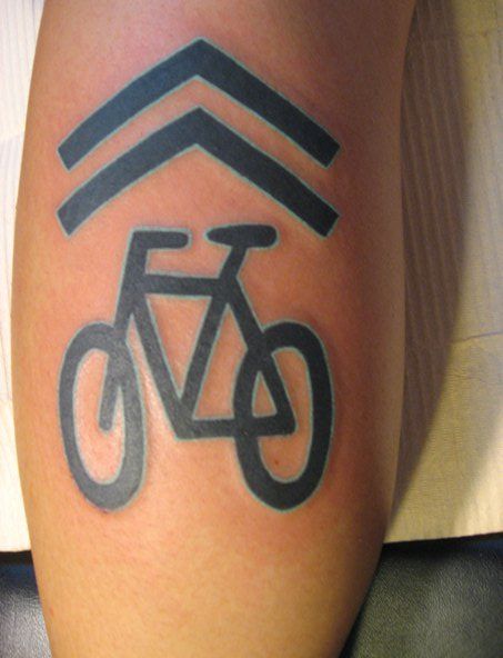 Elegant black bicycle tattoo on leg