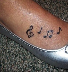 Feel the music star tattoo on leg