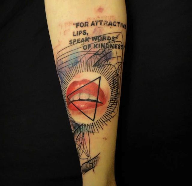 Figures and lips tattoo on arm