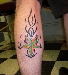 Fire and star tattoo on leg