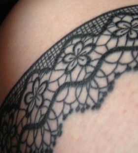 Flowers and cute lace tattoo on arm
