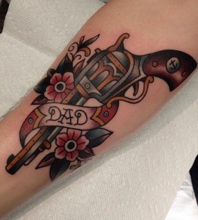 Flowers and dad's gun tattoo