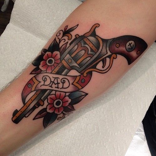 Flowers and dad’s gun tattoo