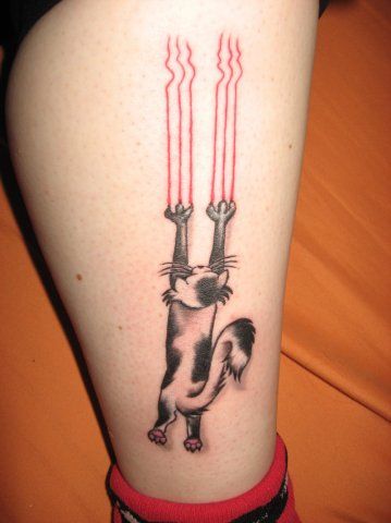 Funny black and white cat tattoo on leg