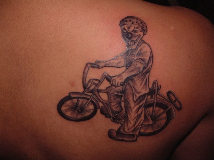 Funny black bicycle tattoo on back