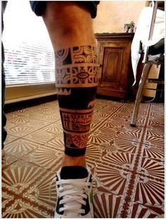 Funny black tribal tattoo on leg