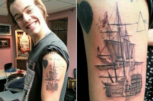 Funny boy’s ship tattoo on arm