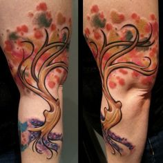 Funny colorful tree tattoo on leg