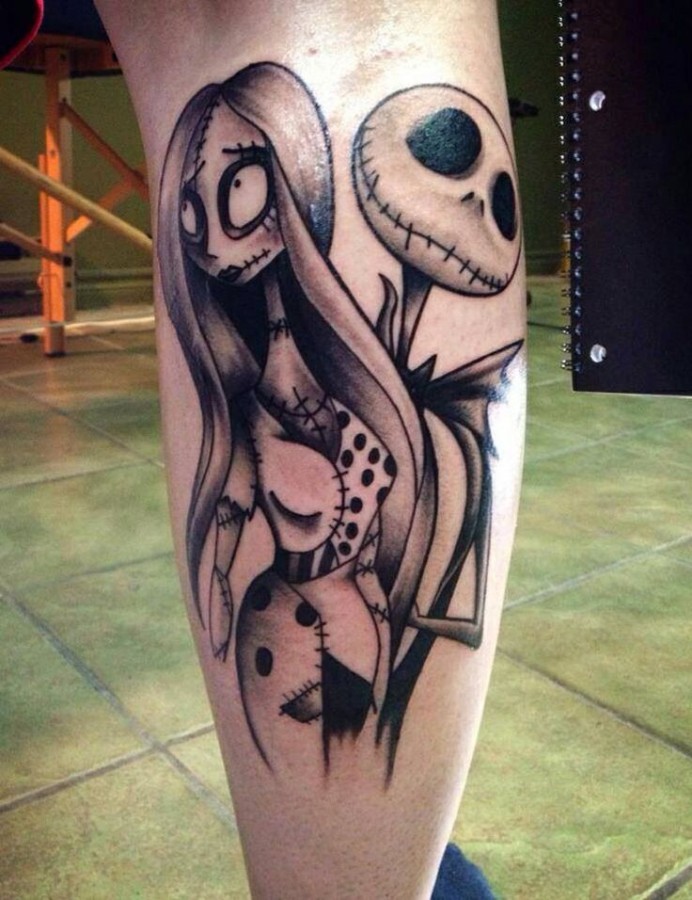 Funny girl and skull face tattoo on leg