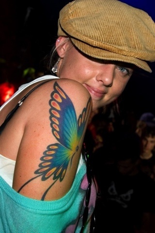 Funny girl butterfly tattoo on arm