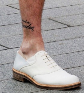 Funny men's quote tattoo on leg