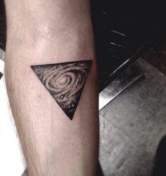 Galaxy in triangle tattoo