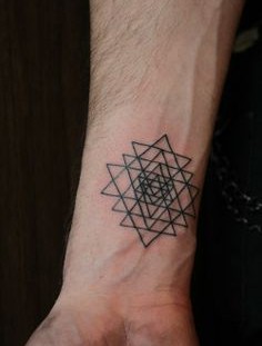 Geometric triangle tattoo