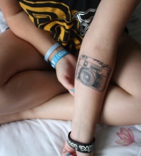 Girl awesome camera tattoo on arm