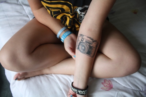Girl awesome camera tattoo on arm