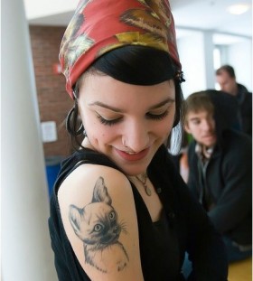 Girl lovely cat tattoo on arm