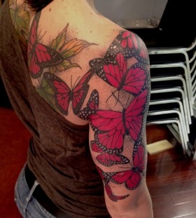Girl shoulder and arm red butterfly tattooo