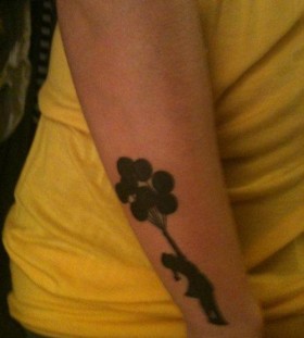 Girl with Bansky tattoo