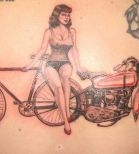 Girl with bike and bicycle tattoo on back