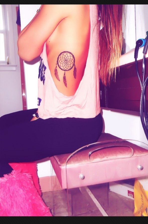 Girl with dream catcher tattoo