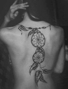 Girl with dream catcher tattoo on back