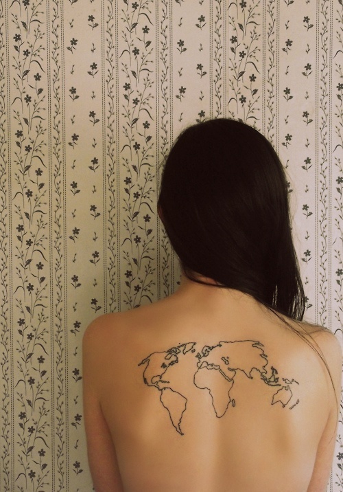 Girl with globe tattoo