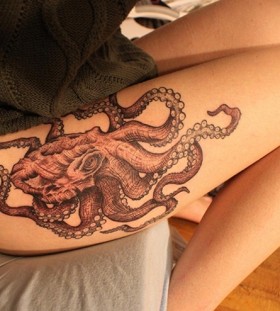 Girl with octopus tattoo on leg