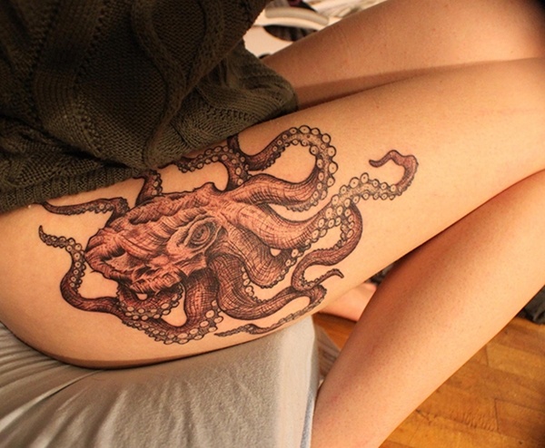 Girl with octopus tattoo on leg