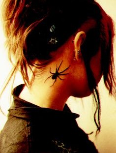 Girl with spider tattoo on neck