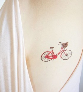 Girl with vintage bicycle tattoo