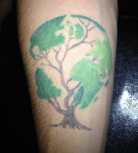 Globe in a tree tattoo